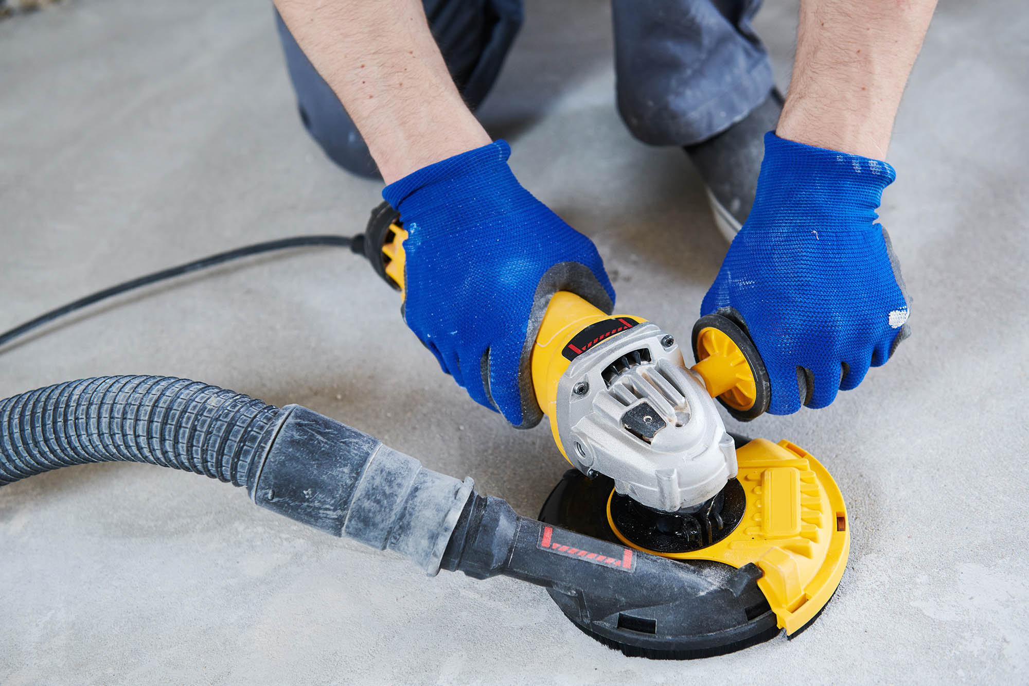 Concrete,floor,surface,grinding,by,angle,grinder,machine